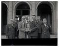 OSC Infantry students and President August Strand posing with a trophy