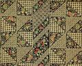 Textile yardage of butter yellow and navy patterned cotton with accent colors of red and green