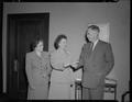 President Strand receiving a $10,000 check from Mrs. Mabel Mack, June 6, 1951