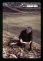 Man posing in fossil beds by high school, Fossil, Oregon, circa 1973