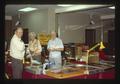 Col Campbell, C. Decker, and Bob Henderson at Henderson Enterprises table, Oregon, 1982