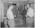 The telephone company's switchboard maze is explained to Lewis Douglas, Franklin High School counselor, by D. W. Graf, transmission man, and E. Ericson, chief test board man, August 10, 1950