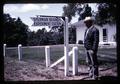 Superintendent Jack McDermid with Sherman Branch Experiment Station sign, Moro, Oregon, circa 1965