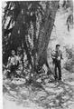Eldon Grable and Edmond Meola pose by large Sitka Spruce tree.