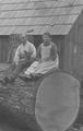 Couple sitting on a log near Timber, Oregon