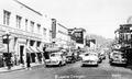 Downtown Eugene with cars lined up at a stop, circa 1955