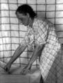 Mrs. C.U. Wood, leader of spread making enterprise, at work