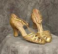 Sandals of gold metallic leather with open woven vamp