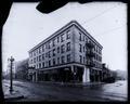 The Hotel Blackstone at Stark and 4th, Portland. Streetcar tracks on street in forground; houses in background.