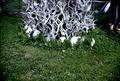 Antler sculpture in barnyard, close up of base