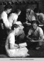 Students, Berea College, reading around the fireplace