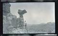 William L. Finley photographing a balancing rock