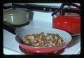 Fried potatoes in pan on stove, 1975