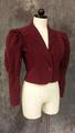 Jacket of maroon corduroy with elongated slim collar lapel notched with a soft curve