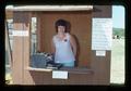 Peggy [?] in ticket booth at fair, 1974