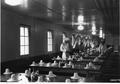 Setting tables in mess room, Lower Cispus CCC camp, Columbia National Forest, Washington