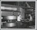 James Brady and Edwin Yunker with the OSC cyclotron