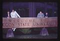 American Field Service (AFS) students with Oregon State University welcome sign, Corvallis, Oregon, 1976