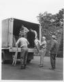 Forest Service Personnel unload chairs from truck