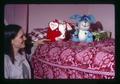 Cynthia Harper in her room with a toy pig and dog, Oregon State University, Corvallis, Oregon, circa 1973