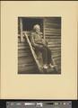 Elderly man [Nick Barton] sitting on ladder to shed [b006] [f011] [002a] (recto)