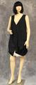 Dress of black and ecru cotton with deep-V neckline