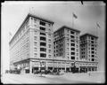 Hotel Multnomah from Fourth St., showing Pine St. face of building. Autos in foreground.