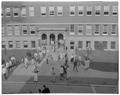 Student class change in front of Commerce Hall (Bexell Hall), November 1960