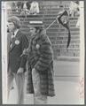 A Beaver football fan stands on the sidelines wearing a Racoon Coat