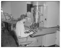 Dean Francois Gilfillan with new electron microscope installed by physics department, 1951