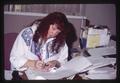 Alumni Secretary at desk in office, Oregon State University, Corvallis, Oregon, 1996