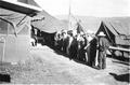 Workers line up for dinner