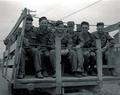 Soldiers sitting in truck on way to fields