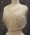 Half blouse of white cotton batiste with embroidered trim