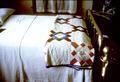 Bed with quilt, second example