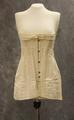 Corset of white cotton with lace trim at top