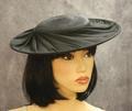 Hat of black straw with shallow crown and wide brim
