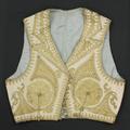 Vest of ecru felt heavily embroidered in metallic gold with yellow couched yarns