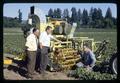 G. Burton Wood, Wilson Foote, and Dean Booster with strawberry harvester, Weston, Oregon, circa 1970