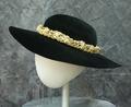 Picture-style hat of black new wool felt with wide brim and shallow rounded crown