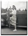 Jeanne Hetherington posing adjacent to a car