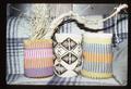 Baskets by Master Artist Francis Brunoe displayed on couch