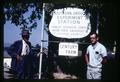 F. C. Reimer and Dr. Porter Lombard with Southern Oregon Experiment Station Hanley Farm sign