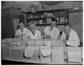 Professor Gustav Wilster and others judging butter, March 1951