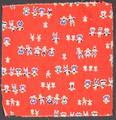Textile panel of red cotton with print of abstract figures (paper dolls) holding hands in small number groups in a linear pattern
