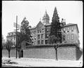 St. Mary's Academy, Portland. Building on hill, stairway from street through stone wall in foreground.