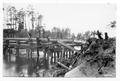 Seven men working on log bridge(2)
