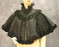 Cape of black striped silk with vertical lines of jet bead-work and chiffon ruffle trim
