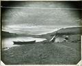 "Home Guard on the Columbia", canoe and tepees on bank of river