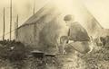 Field Camp with C. P. Cronk cooking breakfast in front of his tent